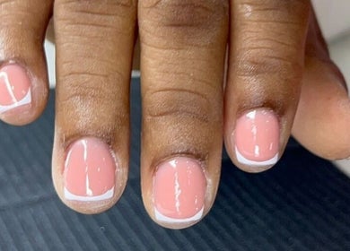 Elegant French manicure at Classy Rose Nail Studio in Sxm, SXM, SX. Perfectly polished nails.
