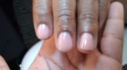 Close-up of a hand showcasing polished nails at Classy Rose Nail Studio, Sxm, SXM, SX.