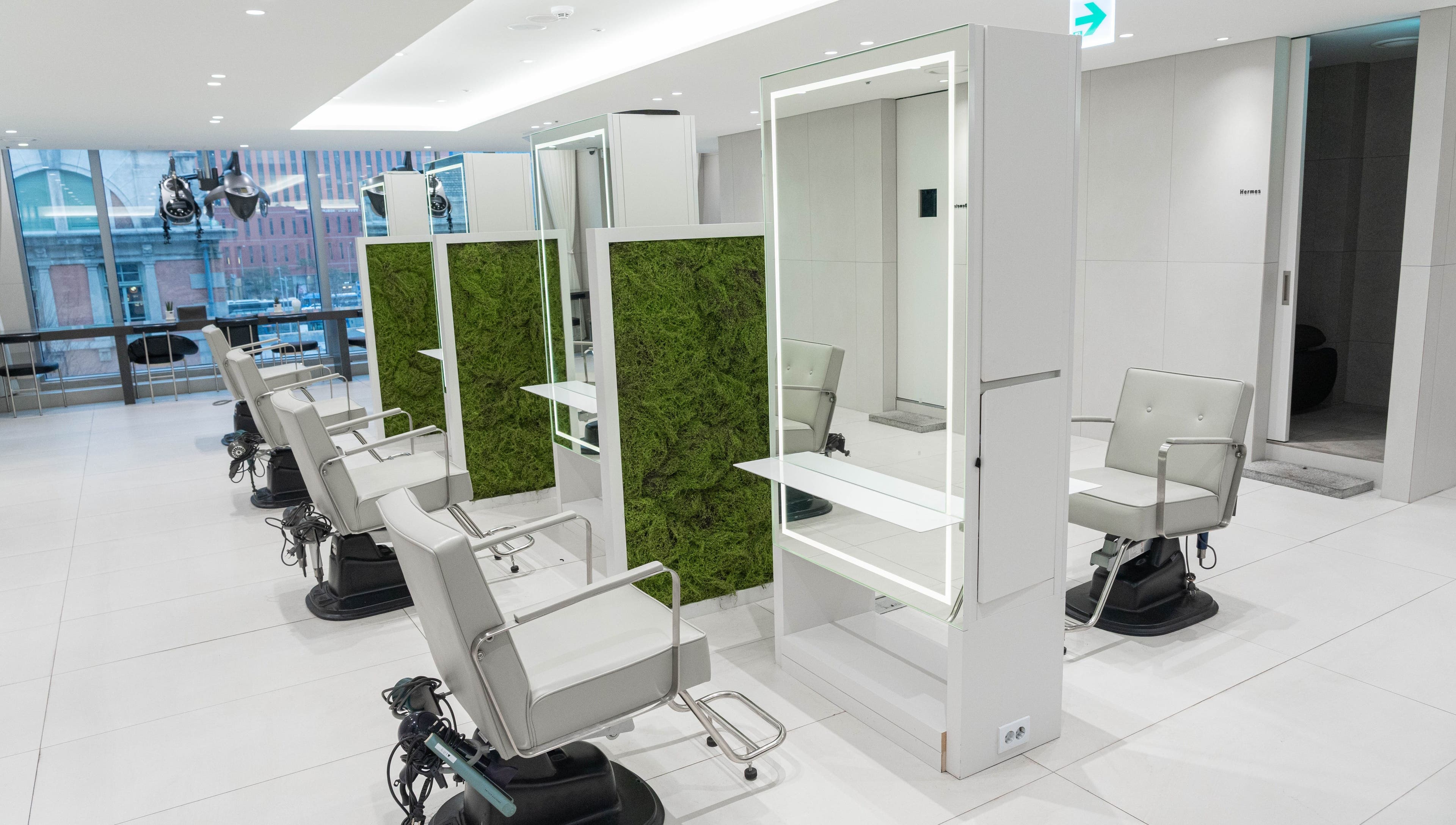 Modern salon chairs at 준오헤어 가든서울역점, Seoul with natural green decor, 서울특별시, 서울특별시, KR.