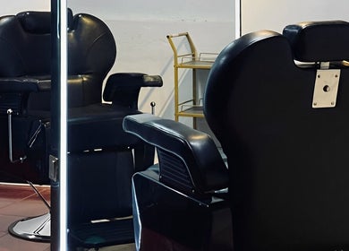 Modern black barber chair at Black Space Barbershop, Biñan, Calabarzon, PH. Stylish grooming setup.