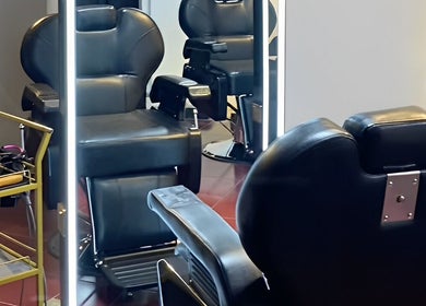 Modern barber chairs at Black Space Barbershop, Biñan, Calabarzon, PH, showcasing comfort and style.