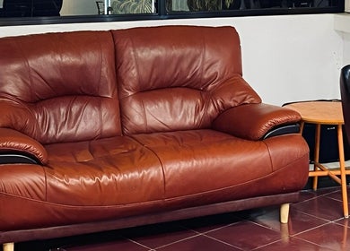 Elegant leather couch at Black Space Barbershop, Biñan, Calabarzon, PH, perfect for customer relaxation.