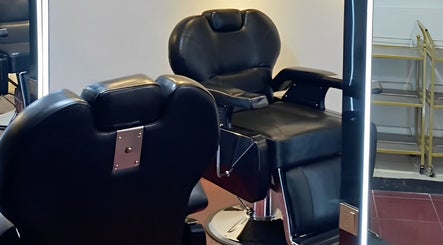 Modern barber chair at Black Space Barbershop, Biñan, Calabarzon, PH, featuring sleek black leather design.