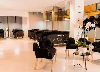 Elegant LashJoy salon in Fortitude Valley, Queensland, AU with stylish chairs and serene beauty beds.
