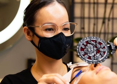 Beauty expert at LashJoy in Fortitude Valley, Queensland, AU, applying lash extensions with precision.