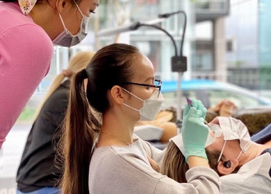 Technician applying eyelashes at LashJoy, Fortitude Valley, Queensland, AU.