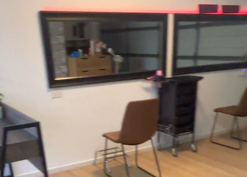 Elegant salon area at ZÜS, Ormeau, Queensland, AU with chic mirrors and modern seating.