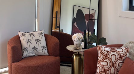 Elegant seating area at Palm Laser, Holsworthy, New South Wales, AU with stylish decor and comfortable chairs.