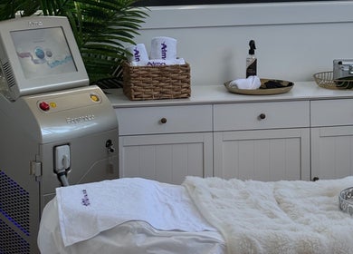 Palm Laser clinic interior with laser machine and cozy decor, Holsworthy, New South Wales, AU.