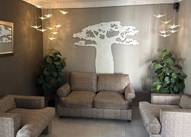 Elegant seating area with baobab decor at Royal Tree Beauty, Potchefstroom, North West, ZA.