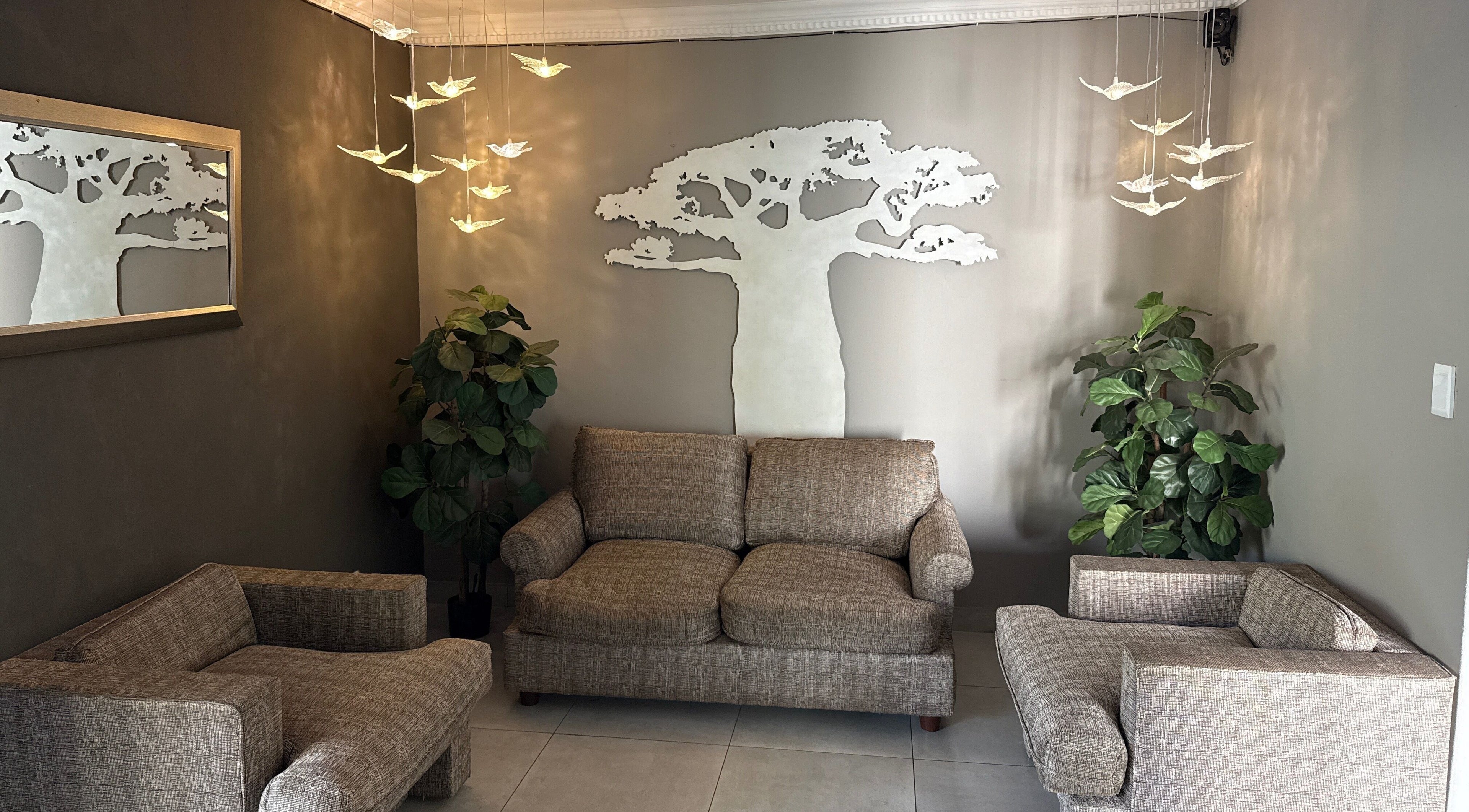 Elegant seating area with baobab decor at Royal Tree Beauty, Potchefstroom, North West, ZA.