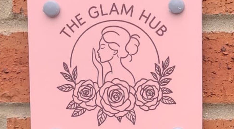 The Glam Hub logo on pink sign with roses, York, England, GB.