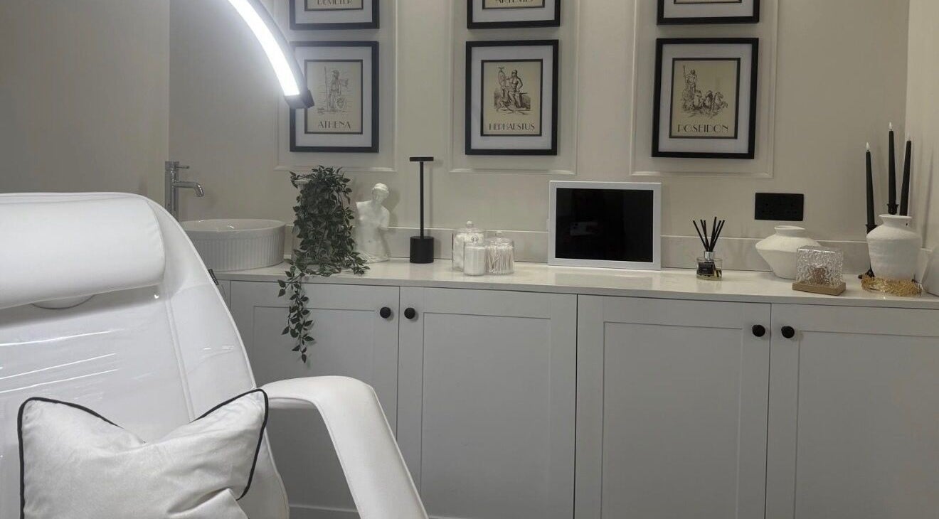 A tranquil spa room at The House Of Hera, Brentwood, England, GB featuring elegant decor and a relaxing chair.