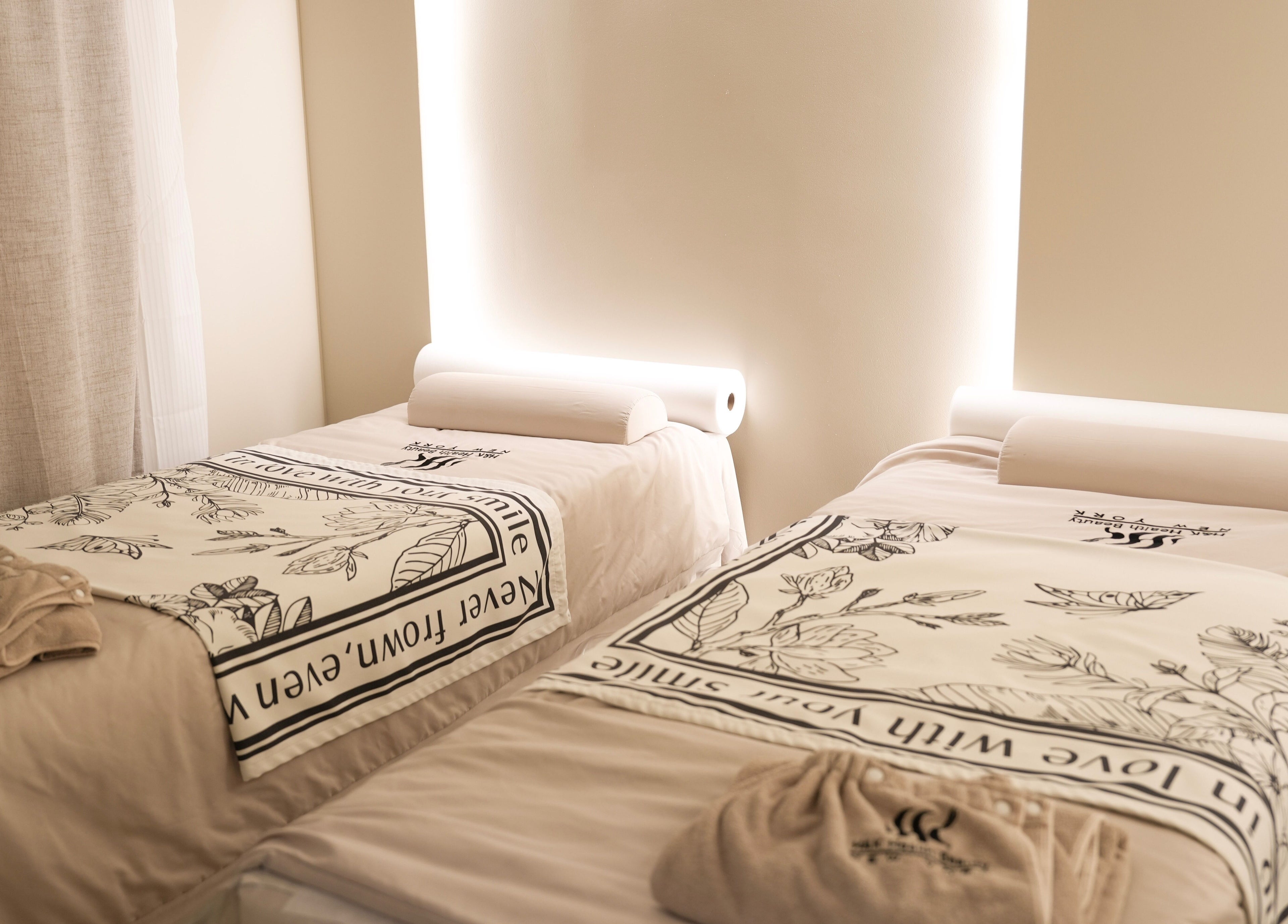 Serene spa beds at H&K Health Beauty in New York, New York, US, offering a relaxing wellness experience.