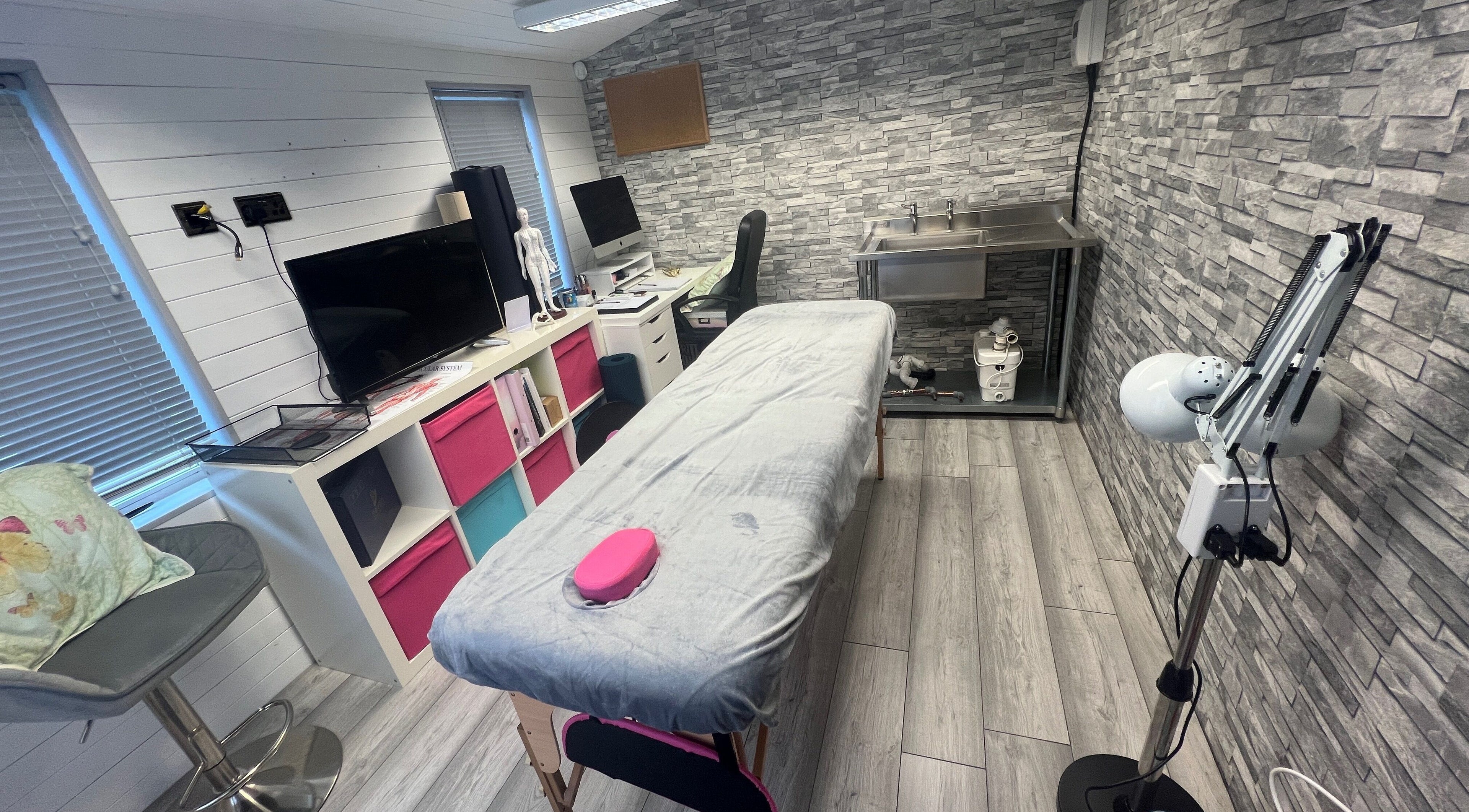 Cozy massage therapy room at Bone & Body Healing, Long Eaton, England, GB, featuring a cushioned table.