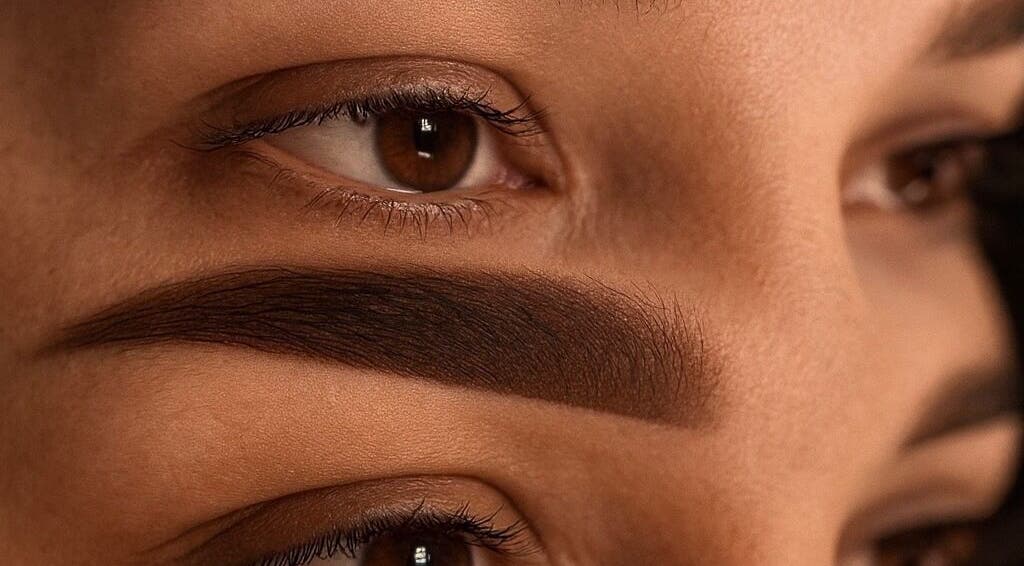 Close-up of expertly shaped eyebrows at EnhancedbyMursal in Toronto, Ontario, CA, showcasing beauty skills.