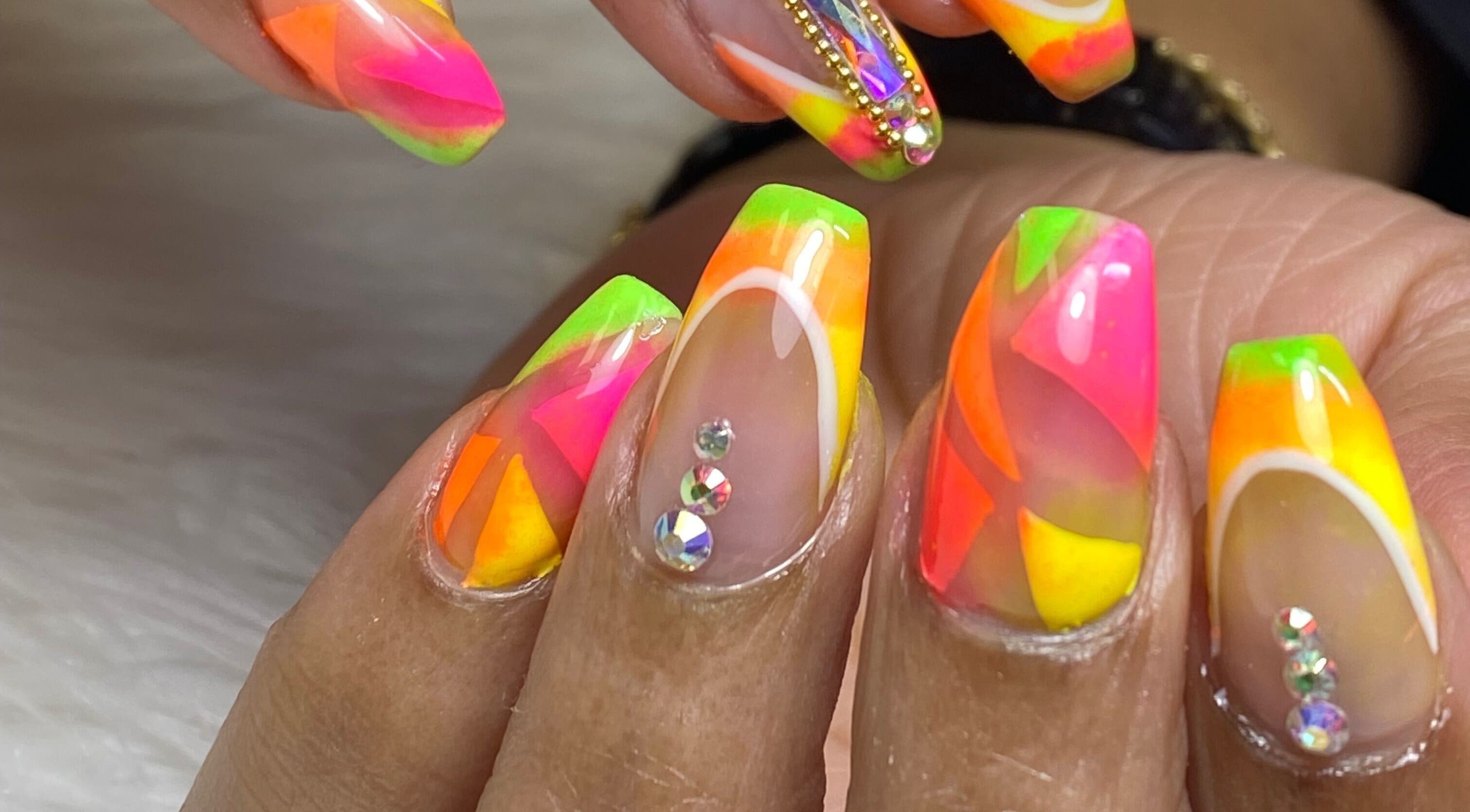 Bright neon nail art with rhinestones at Acacias Nails By JC, Toronto, Ontario, CA.
