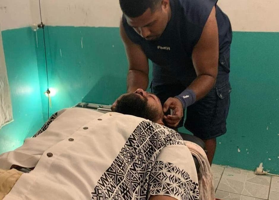 A massage therapist at Dynamic Massage & Adjustment in Suva, Central Division, FJ provides a relaxing neck massage.