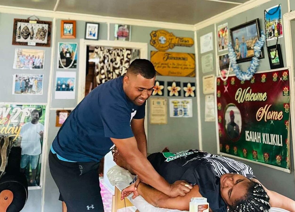 Massage therapist at Dynamic Massage & Adjustment in Suva, Central Division, FJ providing a relaxing session.