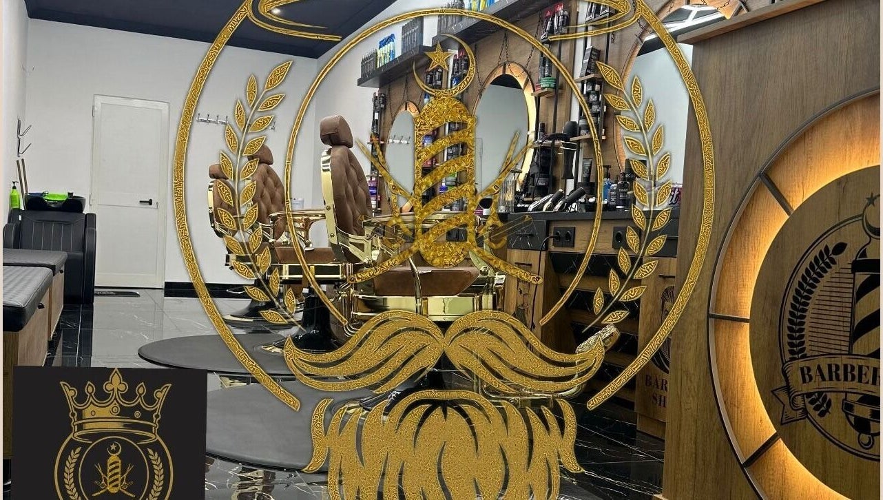 Sophisticated barber chairs and gold-accented decor at D.S.Newlook, San Ġwann, MT.