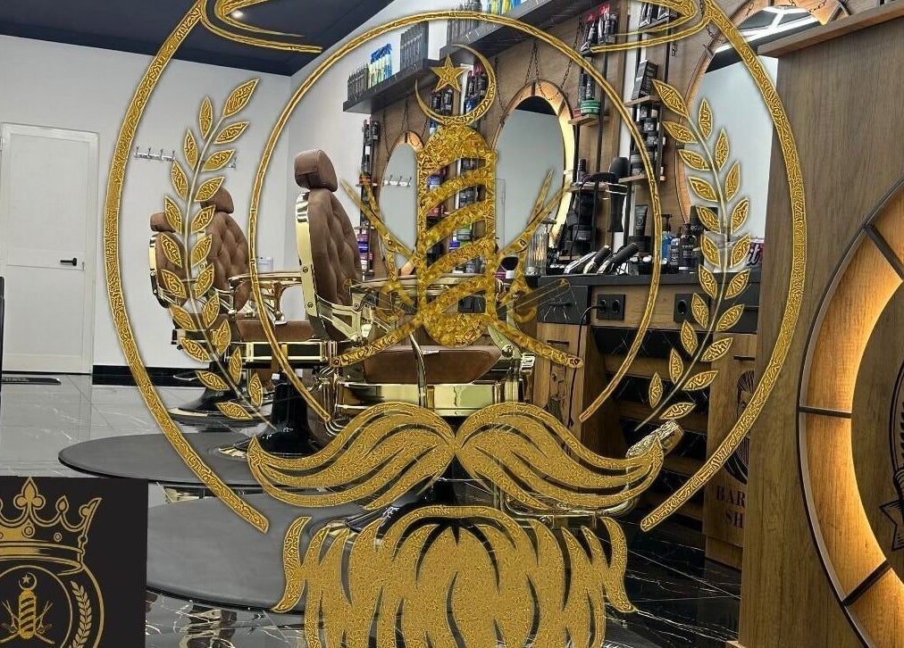 Sophisticated barber chairs and gold-accented decor at D.S.Newlook, San Ġwann, MT.