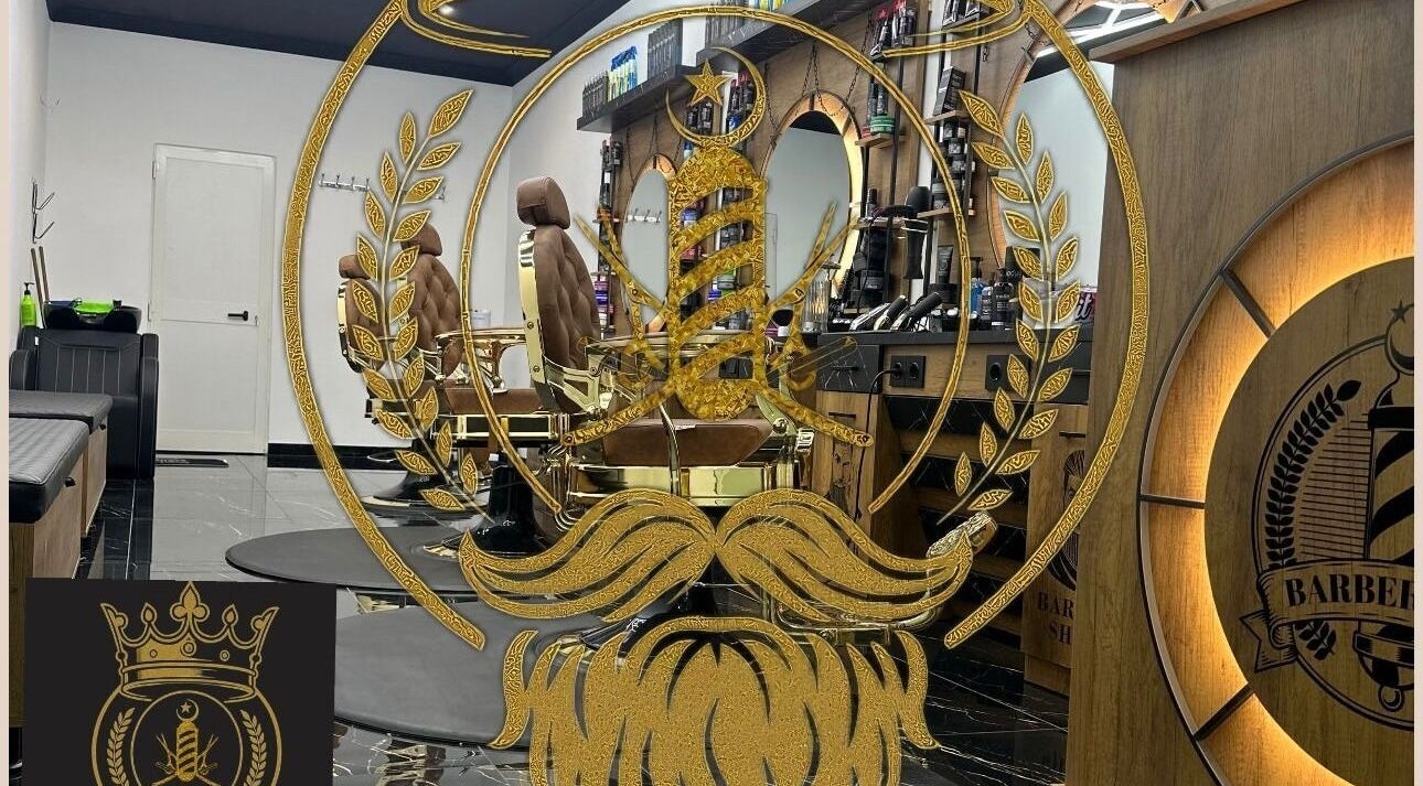 Sophisticated barber chairs and gold-accented decor at D.S.Newlook, San Ġwann, MT.