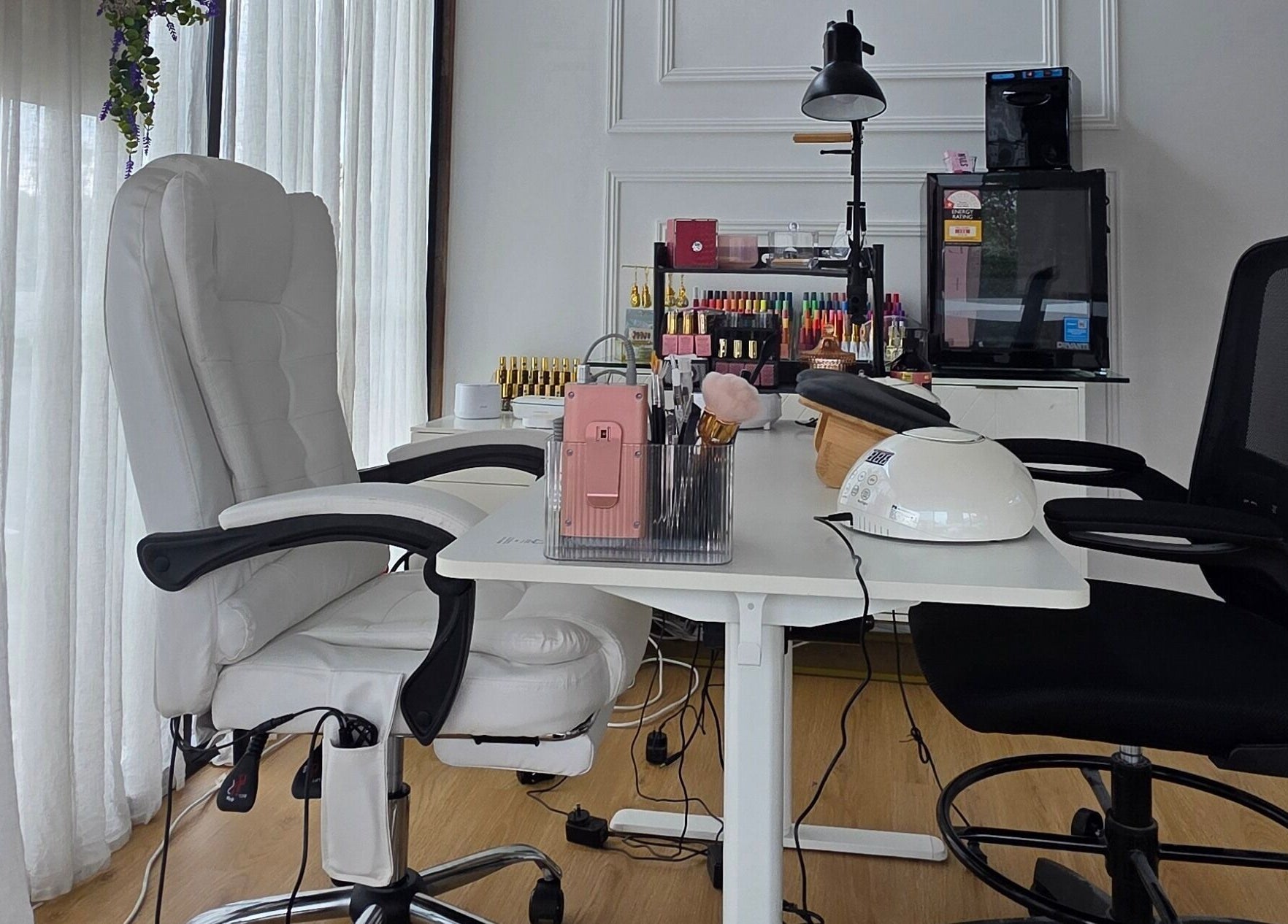 Modern nail salon interior at Nails by Allyssa Marie, Mooloolaba, Queensland, AU with stylish seating.