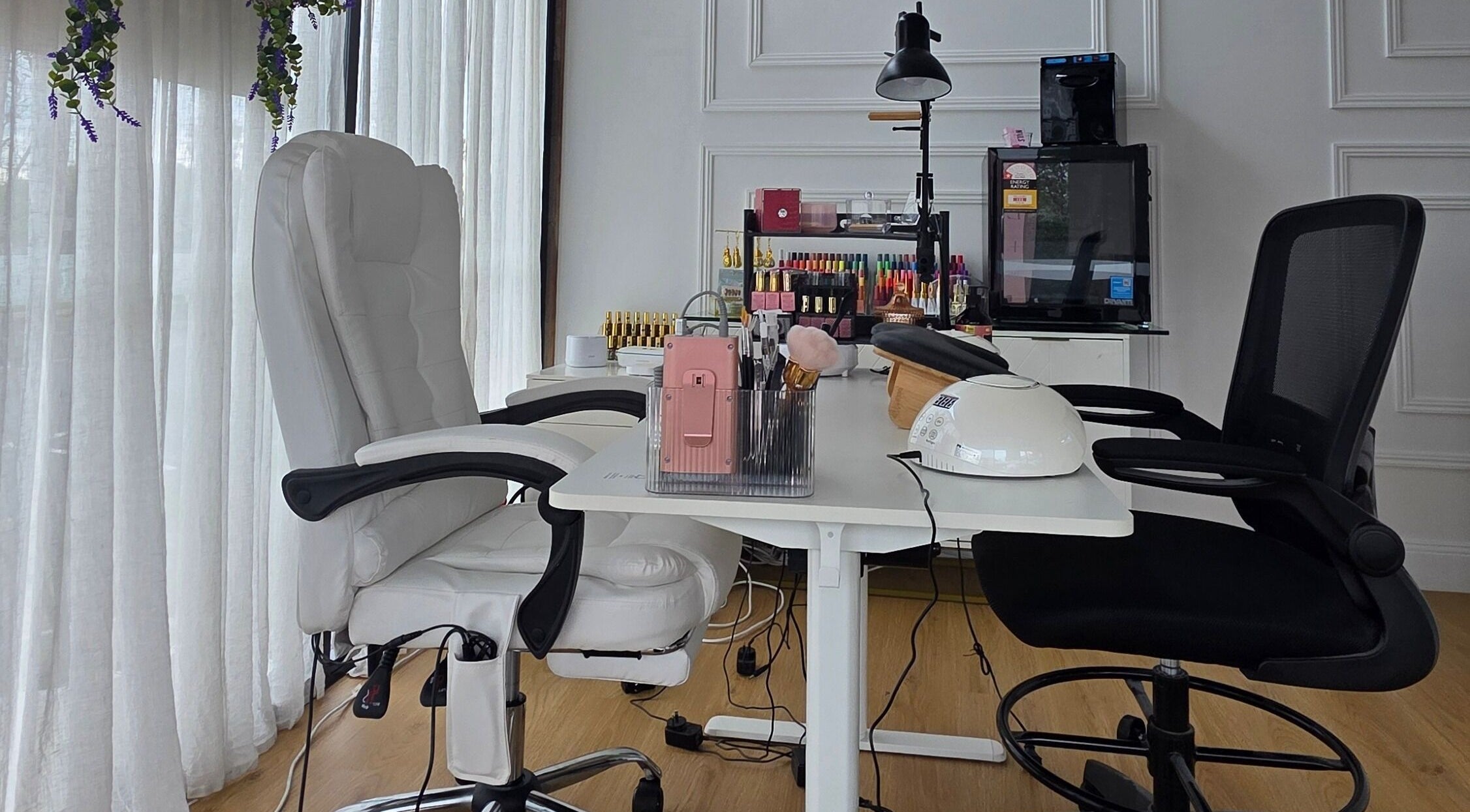 Modern nail salon interior at Nails by Allyssa Marie, Mooloolaba, Queensland, AU with stylish seating.
