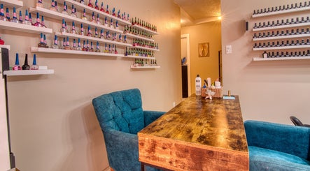Comfortable nail salon seating at 108 Aquarius Spa, Simpson Bay, SX with nail polish shelves.