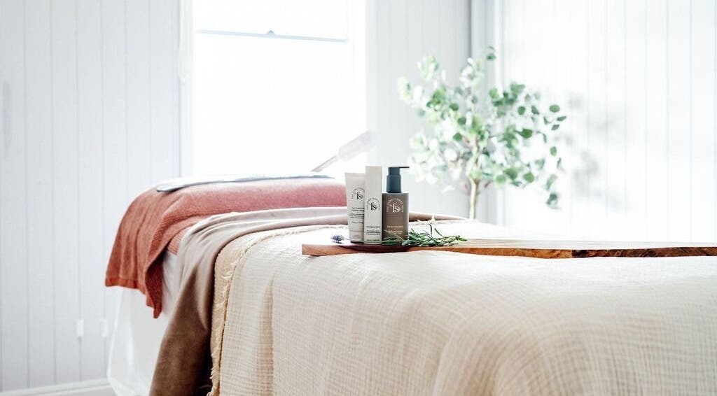 Massage table with products at Ossian in Warwick, Queensland, AU, enhancing relaxation and wellness.