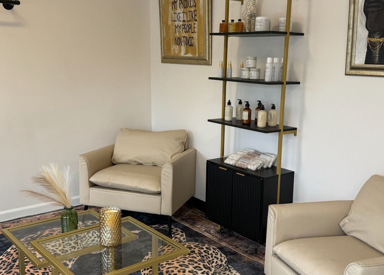 Stylish seating area at Studio Sol, Farmingdale, New York, US featuring cozy chairs and elegant decor.