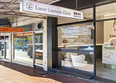 Entrance of Lueur Clinic in North Willoughby, New South Wales, AU showcasing its modern glass exterior.