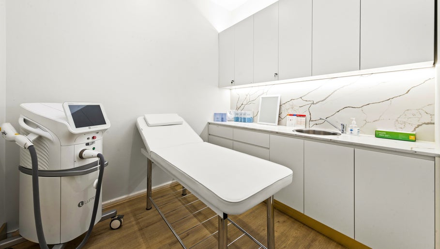 Modern treatment room at Lueur Clinic, North Willoughby, New South Wales, AU with sleek cabinetry and equipment.