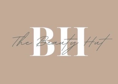 The Beauty Hut logo on a beige background in Bourne, England, GB.