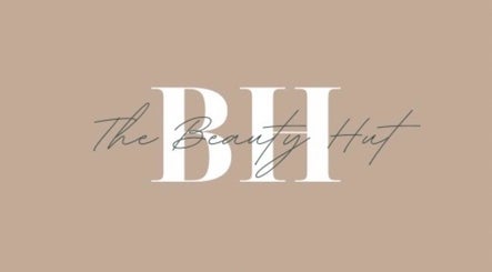 The Beauty Hut logo on a beige background in Bourne, England, GB.