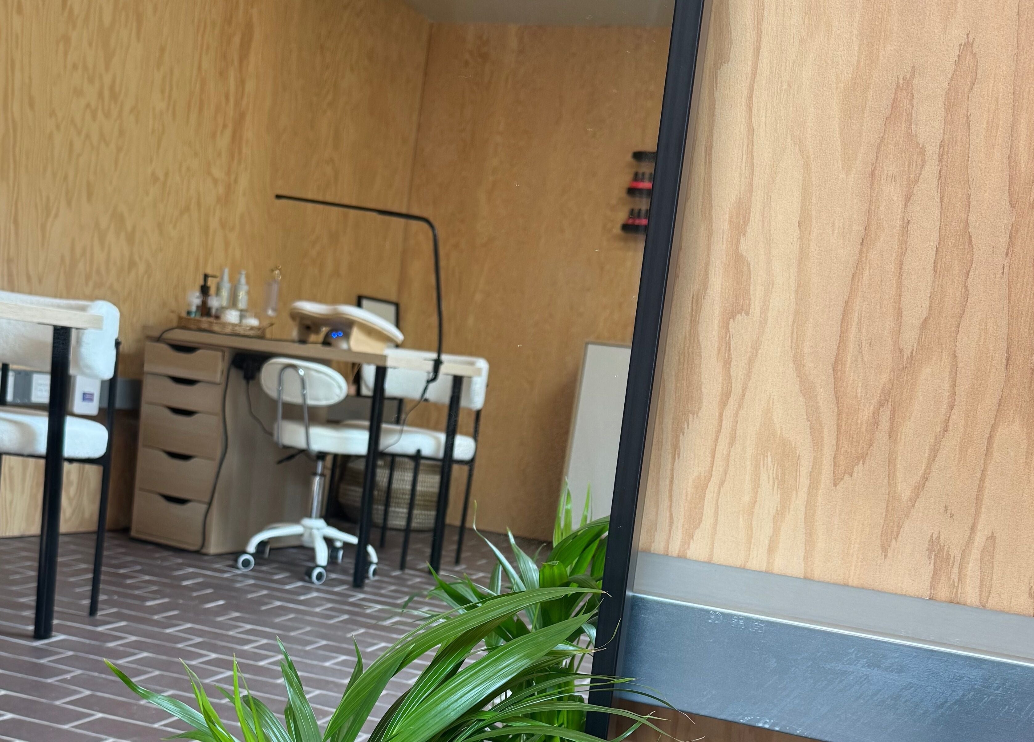 Cozy interior of The Beauty Studio, Peterborough, England, GB, featuring stylish nail stations.