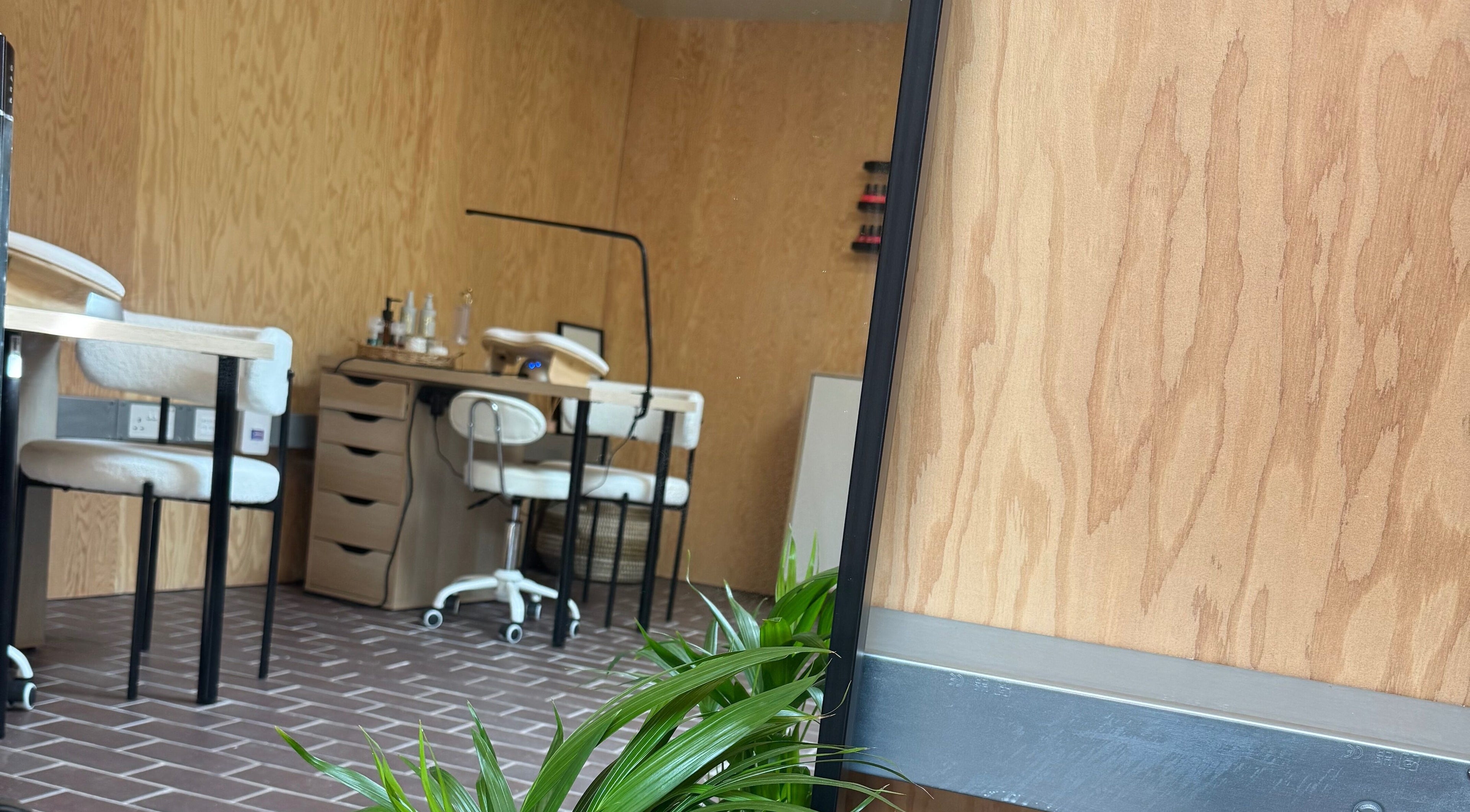 Cozy interior of The Beauty Studio, Peterborough, England, GB, featuring stylish nail stations.