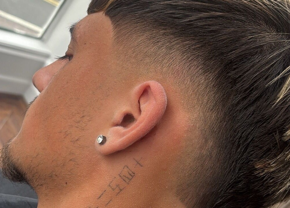 Close-up of trendy fade haircut at H E I G H T S in Dundee, Scotland, GB.