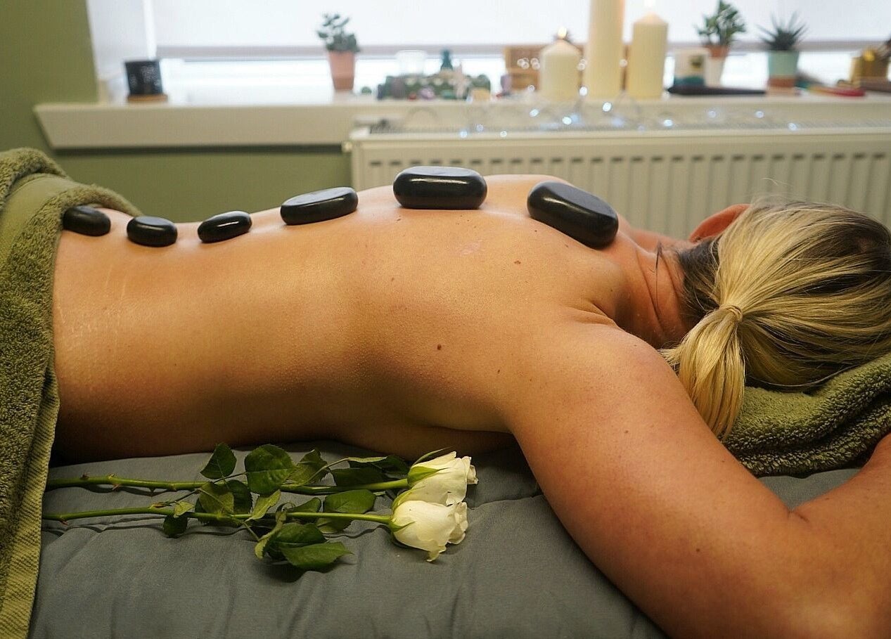 Hot stone massage at Holistic Healing by Lorraine, Dumbarton, Scotland, GB. Relaxing wellness experience.