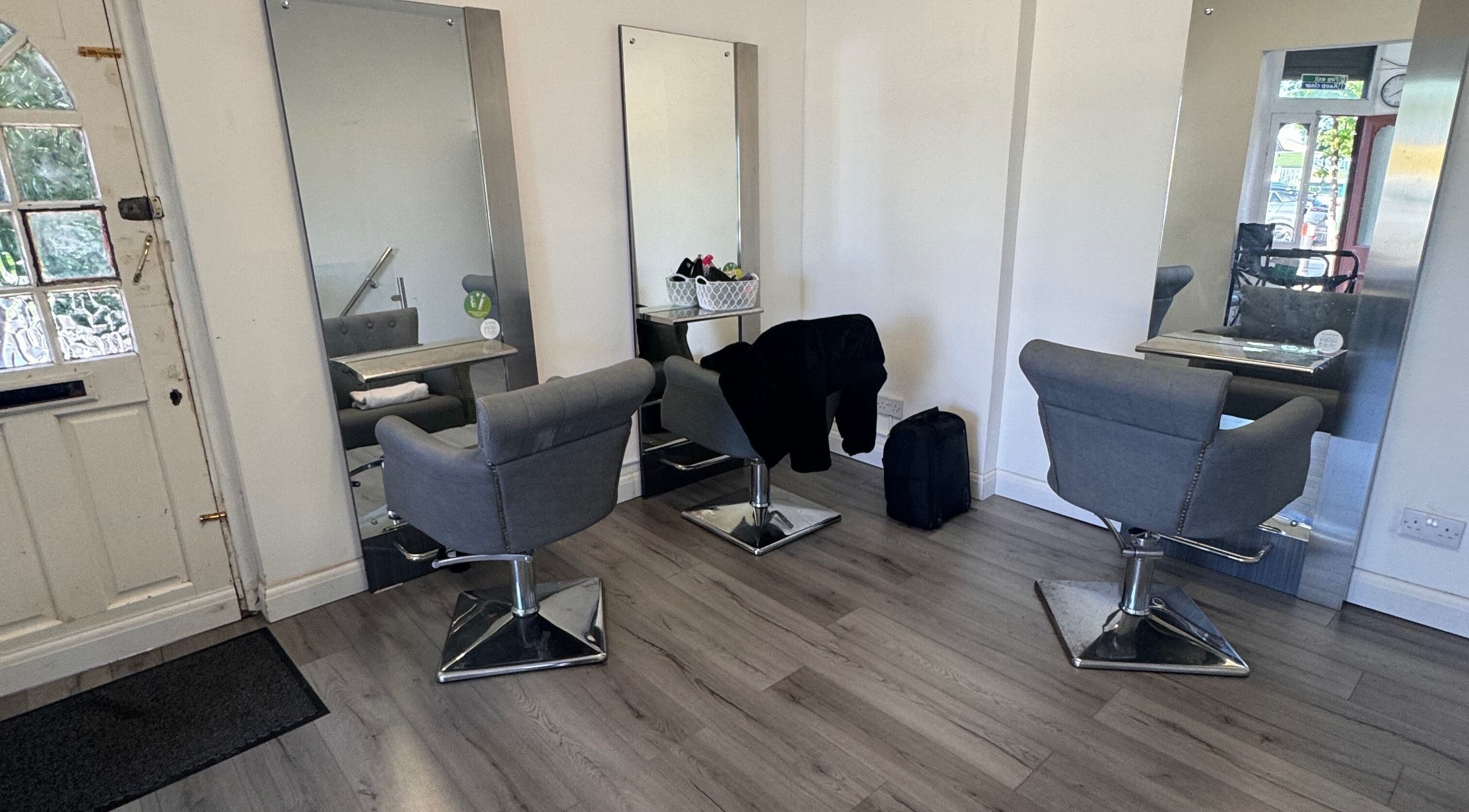 Modern salon interior with chic chairs at TeeBeauty World, Manchester, England, GB.