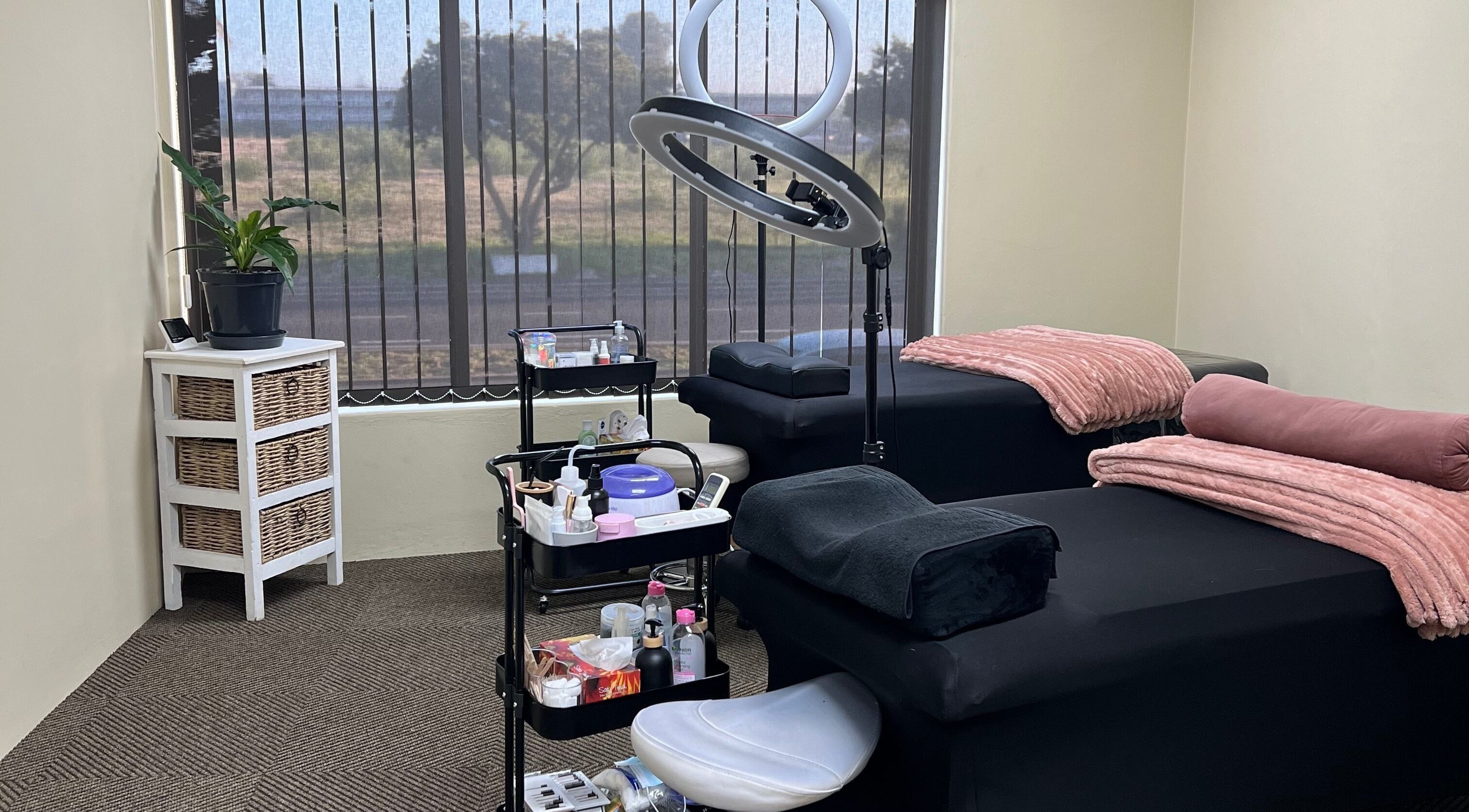Cozy beauty room at Dream It Lashes & Beauty By Mel, Cape Town, Western Cape, ZA with treatment beds and warm decor.