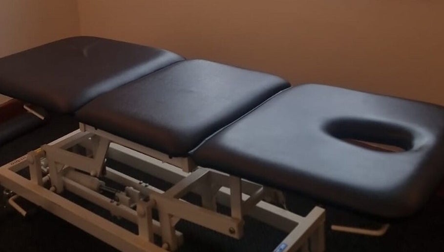 Massage therapy table at Elite Therapy in Luton, England, GB, offering relaxation and wellness.