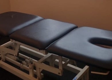 Massage therapy table at Elite Therapy in Luton, England, GB, offering relaxation and wellness.