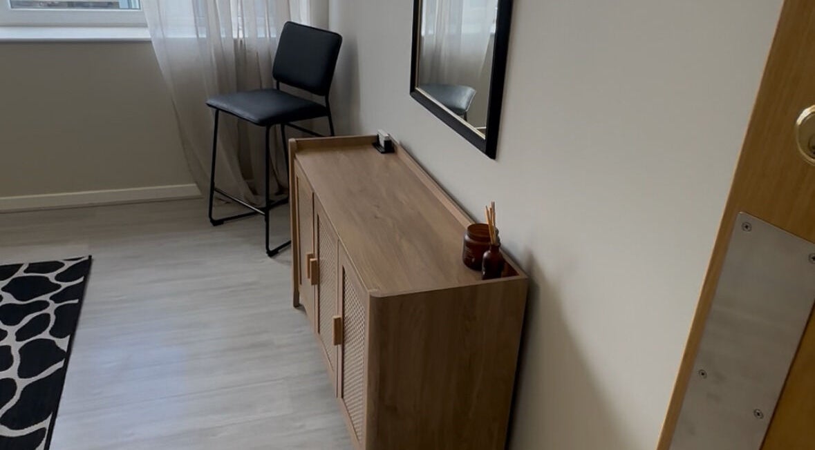 Chic waiting area at Hidden Beauty in Stornoway, Scotland, GB with modern decor and a cozy chair.
