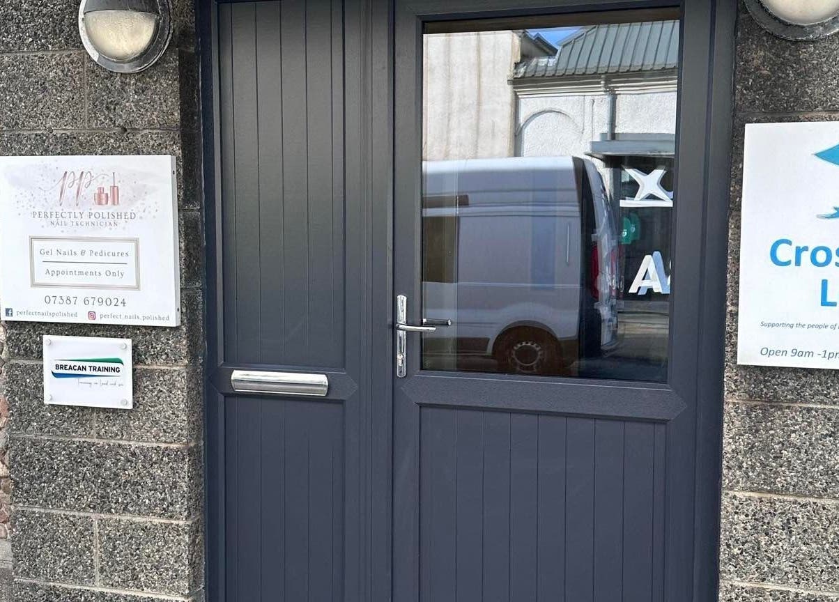 Stylish entrance to Hidden Beauty, showcasing modern door and signage in Stornoway, Scotland, GB.