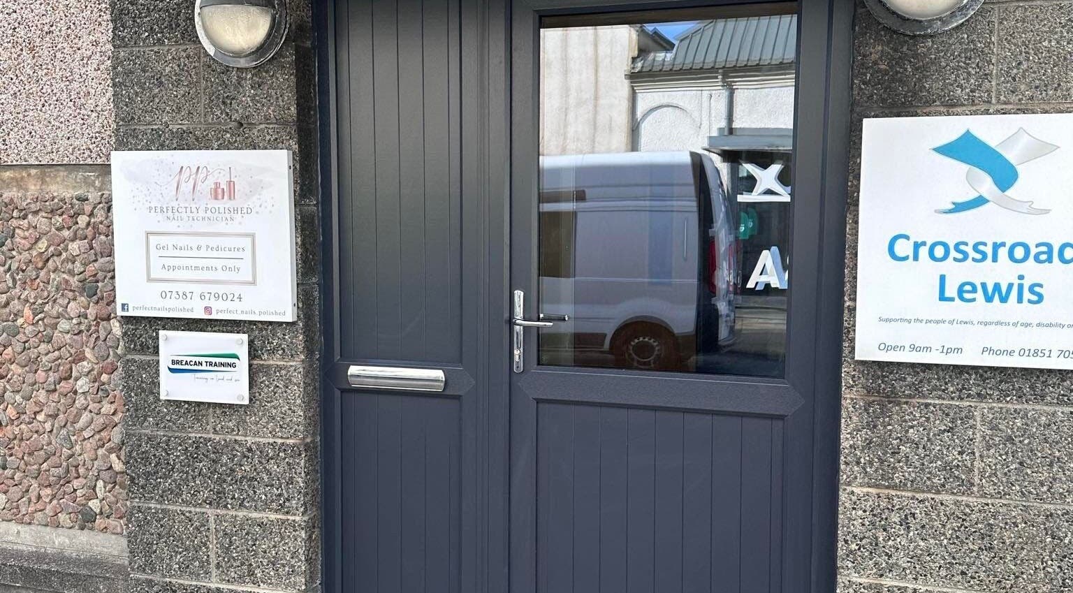 Stylish entrance to Hidden Beauty, showcasing modern door and signage in Stornoway, Scotland, GB.
