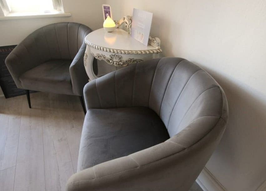 Relax Greyton Spa waiting area with cozy grey chairs in Greyton, Western Cape, ZA. A peaceful retreat.