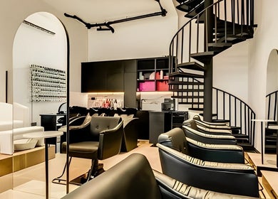 Elegant interior of Repose Ladies Salon L.L.C in Dubai, Dubai, AE showcasing modern design and spiral staircase.