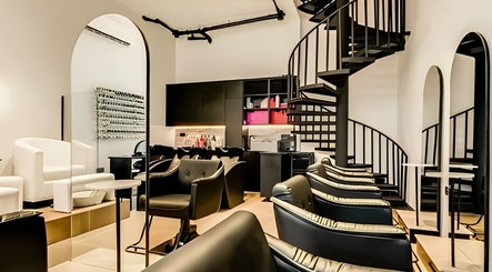 Elegant interior of Repose Ladies Salon L.L.C in Dubai, Dubai, AE showcasing modern design and spiral staircase.