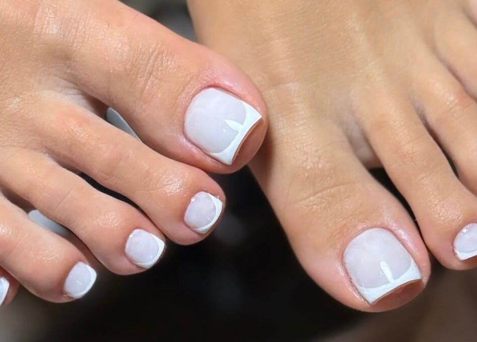 Elegant French pedicure at Repose Ladies Salon L.L.C, Dubai, Dubai, AE, showcasing expertly polished nails.